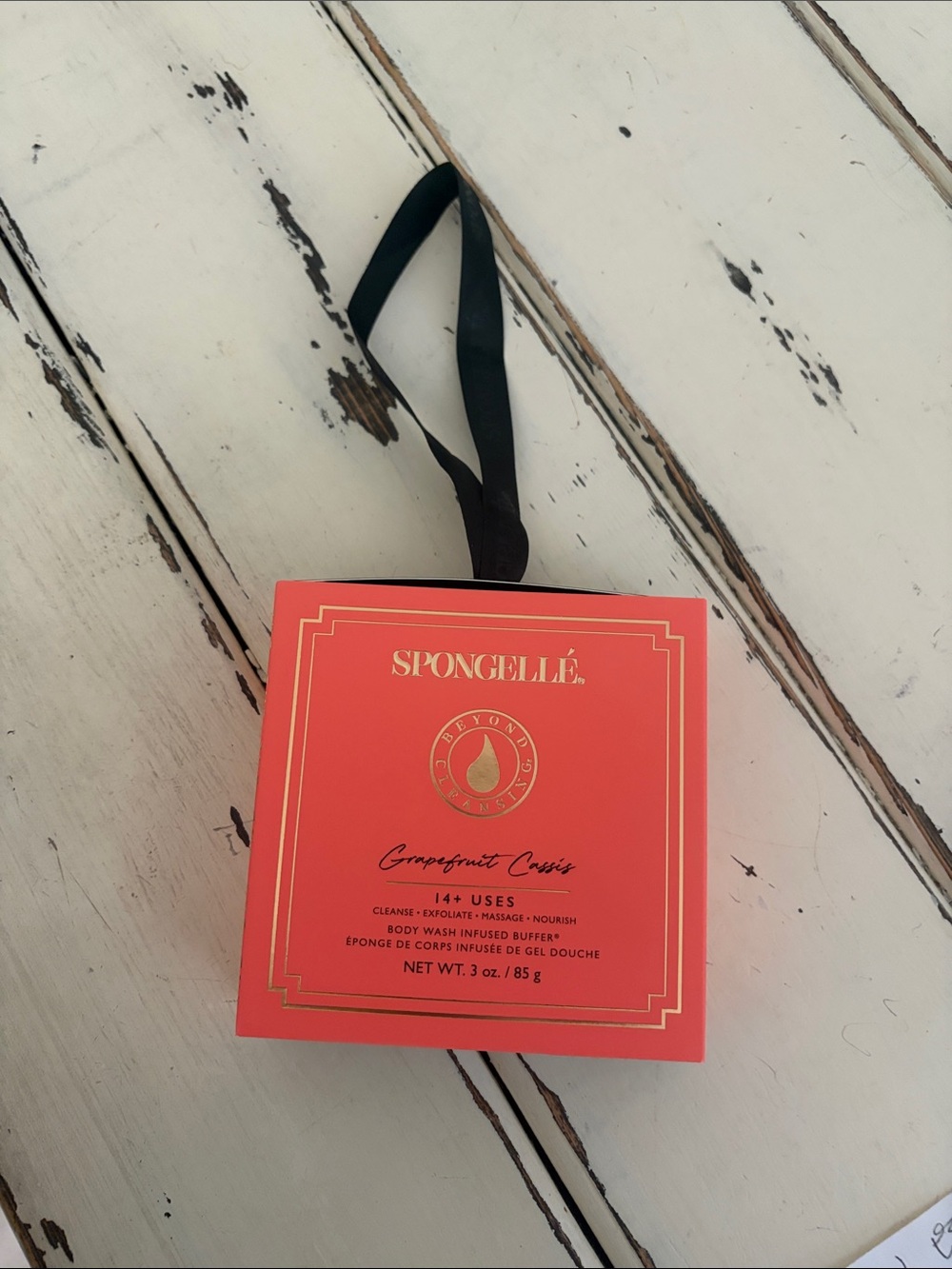 Spongellé Grapefruit Cassis Bath Buffer in Coral and Black